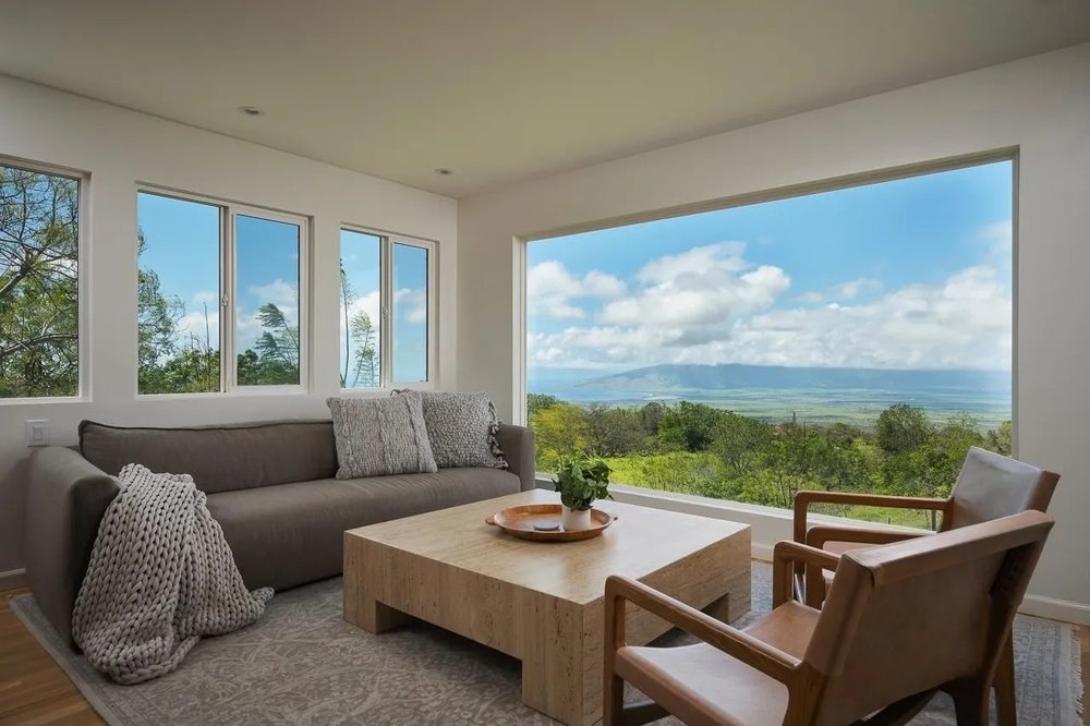 Living space with a large scenic window at a luxury home in Hawaii belonging to supermodel Jessica Stam