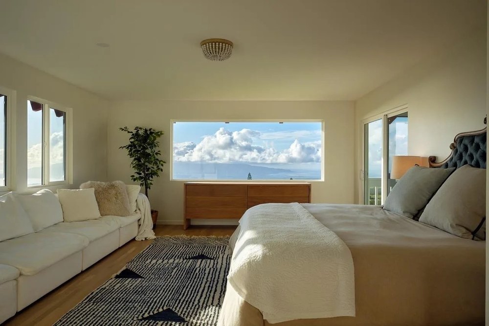 A bedroom with a balcony in a luxury home in Hawaii belonging to supermodel Jessica Stam