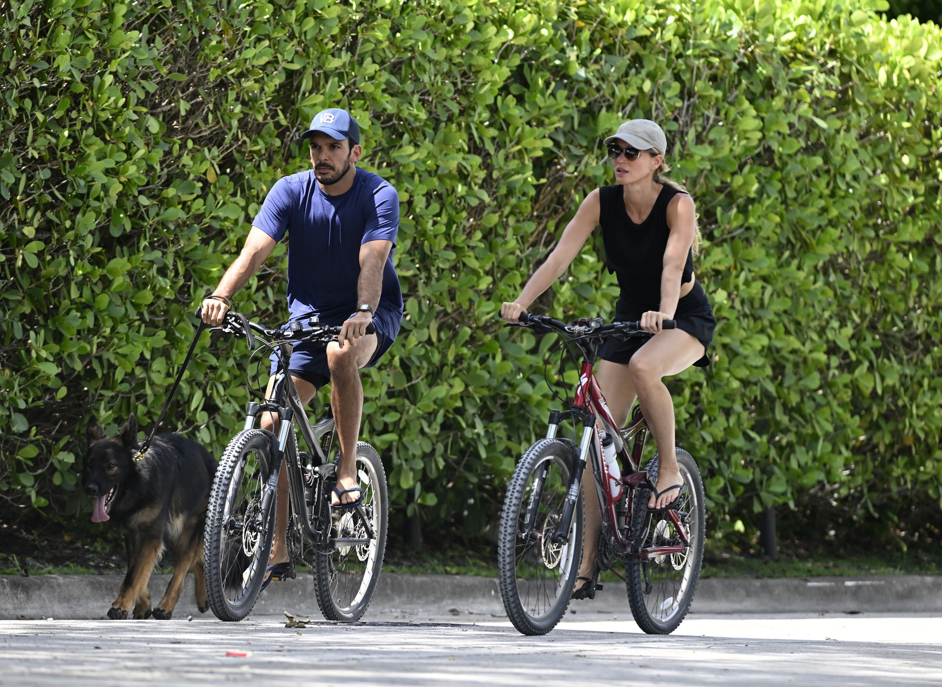 SURFSIDE, FL - JULY 14: Joaquim Valente and Gisele Bündchen are seen on a bike ride on July 14, 2024 in Surfside, Florida. (Photo by MEGA/GC Images)