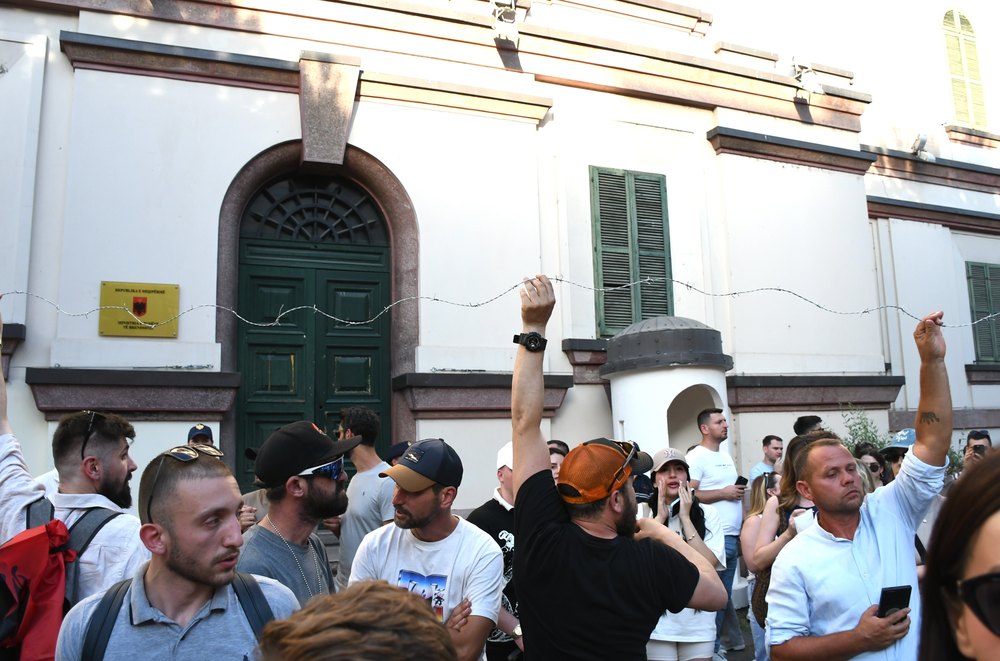 TIRANA, ALBANIA - JUNE 02: Protesters are pulling barbed wire as demonstrators gather in the capital city of Tirana to protest against a planned tourism project in the Zvernec region of Vlora, calling it a sell-out of the country's coastlines with the slogan 'Albania is not for sale' in Tirana, Albania, on June 02, 2026. Protesters stated that they opposed construction activities in protected areas in the country and chanted slogans such as 'Albania is ours.' (Photo by Olsi Shehu/Anadolu via Getty Images)