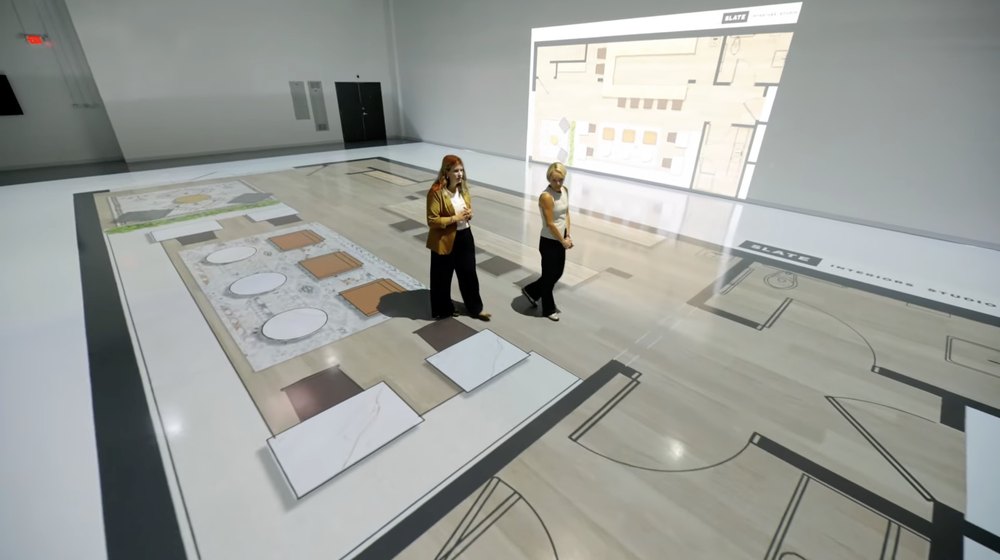 Walk Your Plans clients are seen walking through plans for their home inside the company's studios