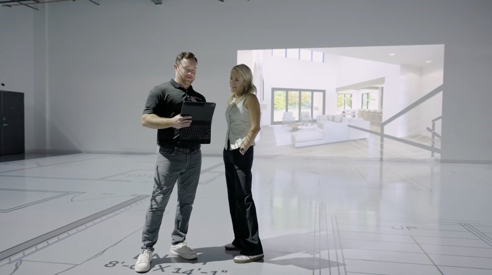 Walk Your Plans clients are seen walking through plans for their home inside the company's studios