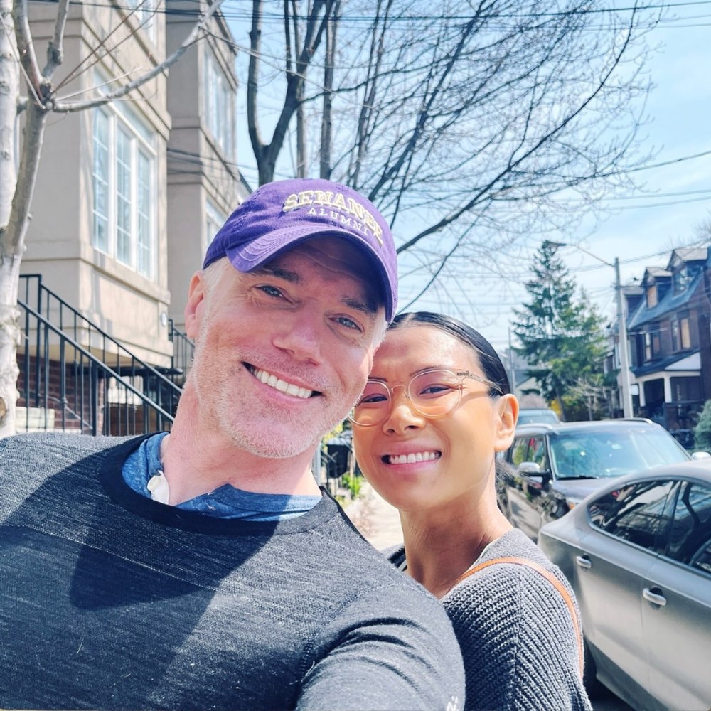 Anson Mount poses for a photo with his wife Darah Trang