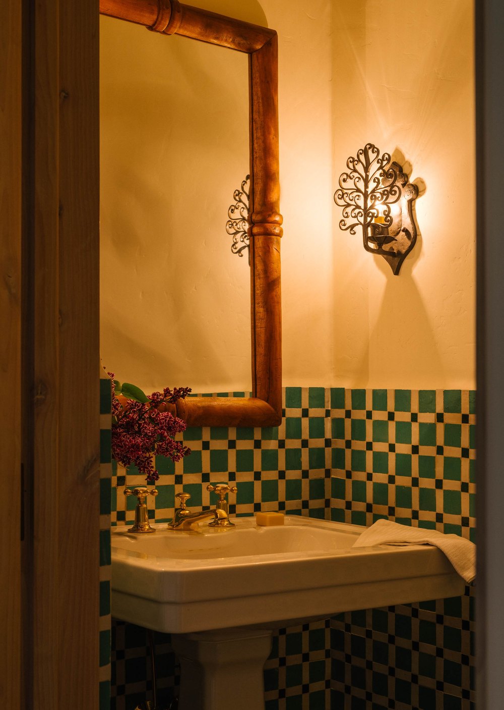 The hotel-inspired aesthetic utilized "antique, dark wood furniture mixed with oak furniture mixed with vintage antique pieces, [and] some terracotta."