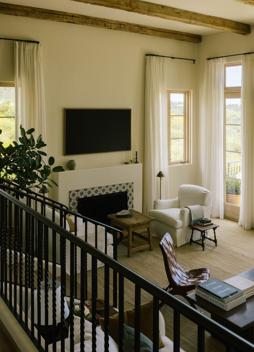 The unique tile that surrounds the living room fireplace is one of Kaprelian's favorite design accents in her sanctuary.