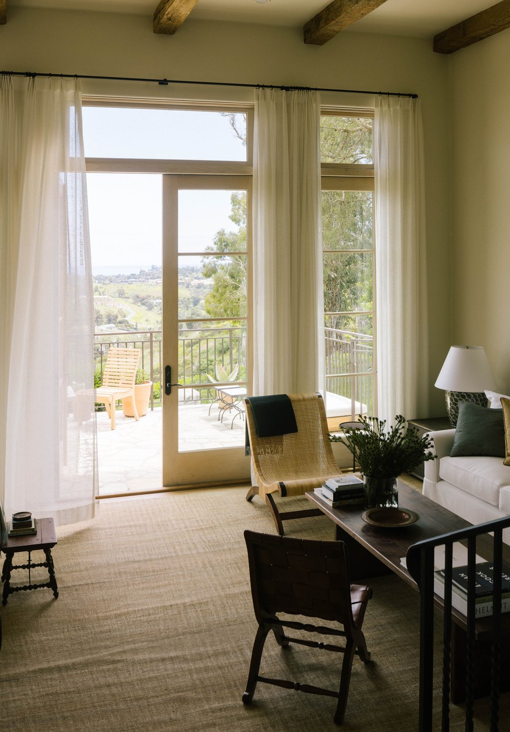 The living room is a true indoor-outdoor space where Kaprelian often leaves the doors wide open and takes in the ocean view.