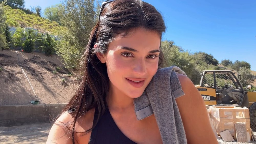 Kylie Jenner Standing Outdoors in Casual Attire Next to Construction Equipment