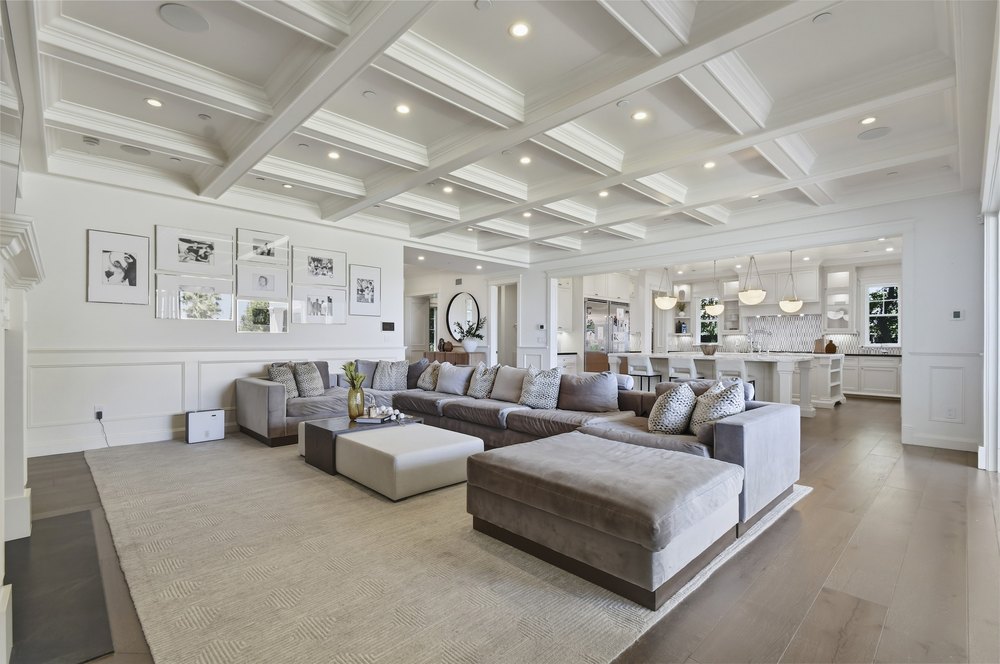 Open-Concept Living Room with White Coffered Ceiling Beams and Plush Sectional Sofa