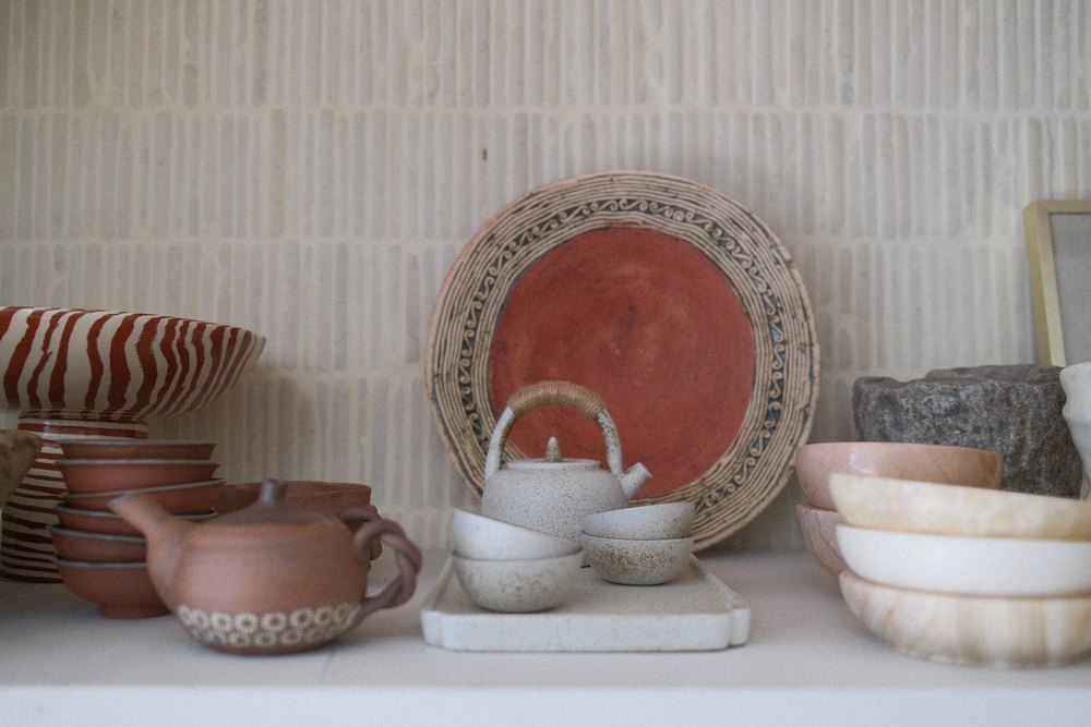 Devlukia's ceramics collection is comprised of items she's created in pottery and things she's found in farmers' markets around the world.