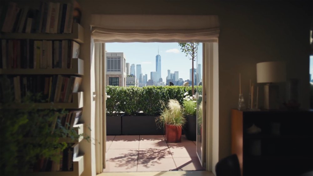Open Terrace Glass Door View of New York City Skyline Frame