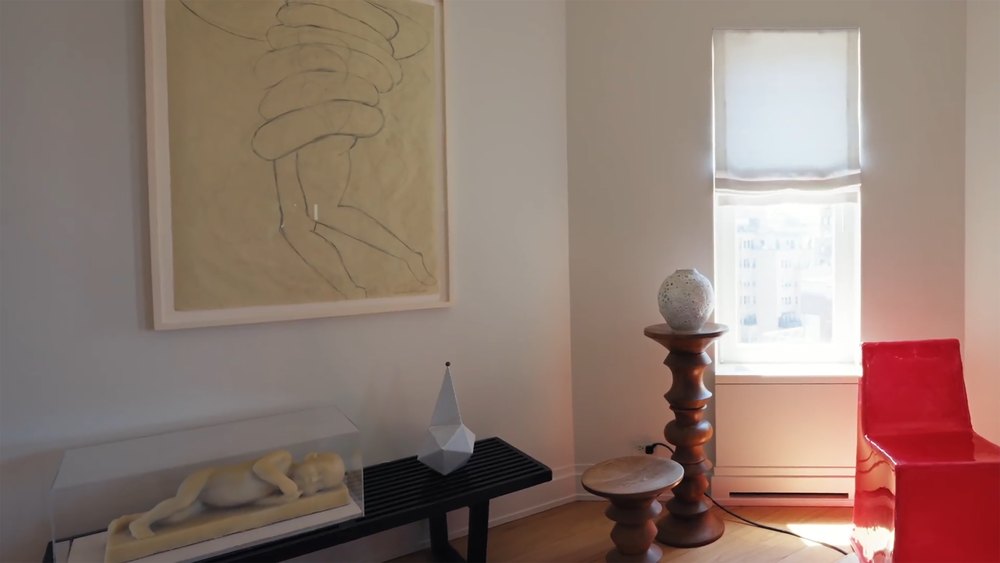 Modern Art Nook with Framed Wall Painting, Wooden Pedestal, and Red Chair