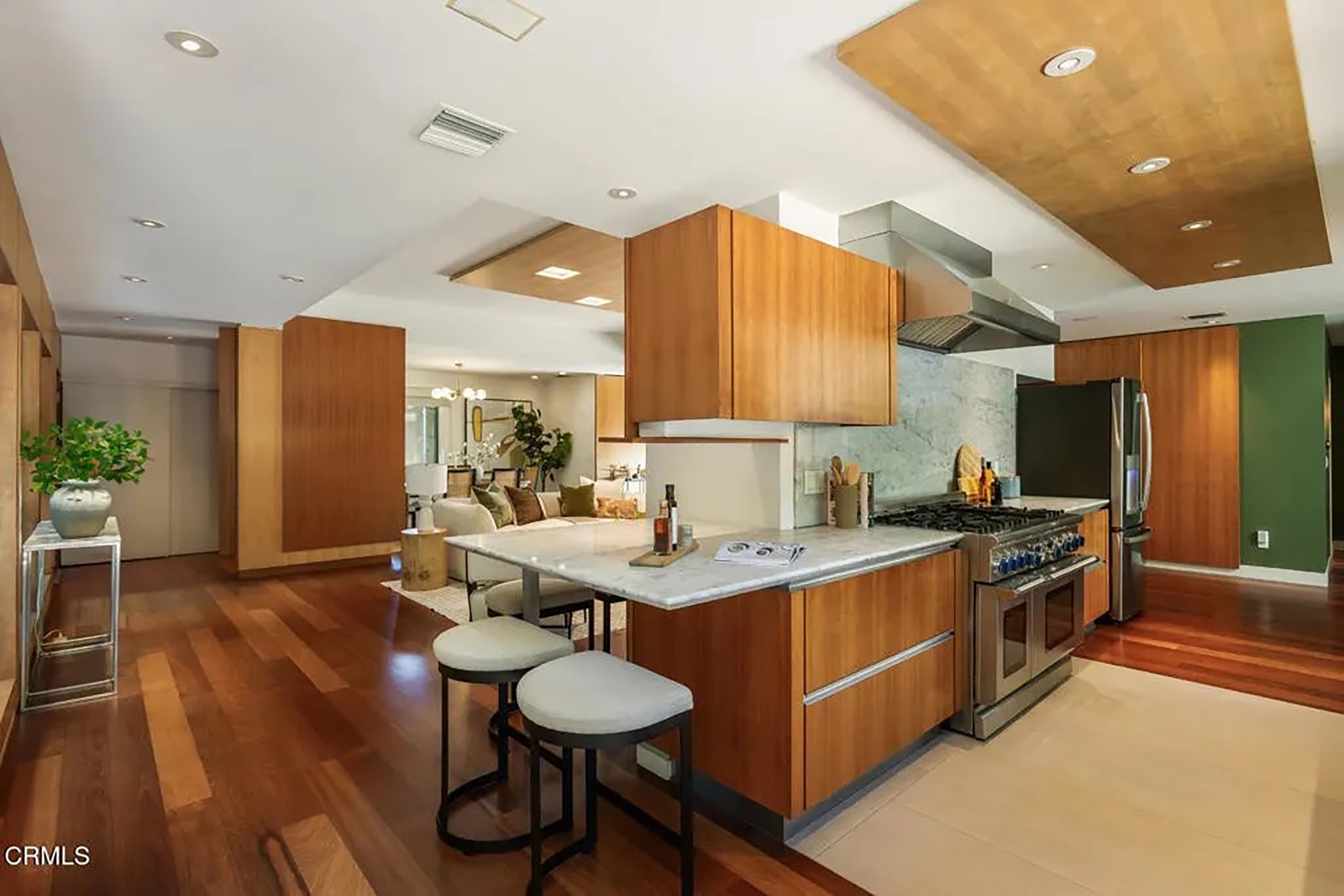 Modern Kitchen with Wood Cabinets, Stainless Steel Appliances, and Tile Floor