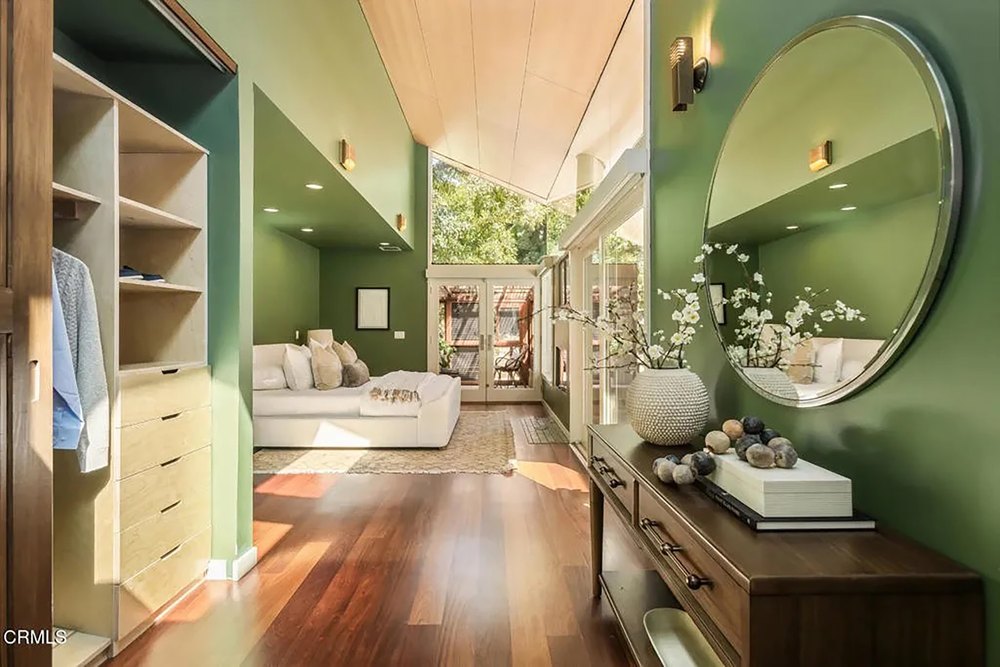 Wood-Paneled Entryway Nook Leading into Modern Bedroom with High Ceiling
