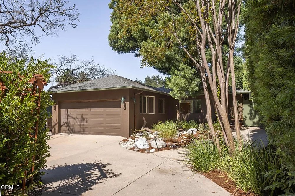 Exterior Front View of Single-Story Home with Driveway and Landscaping